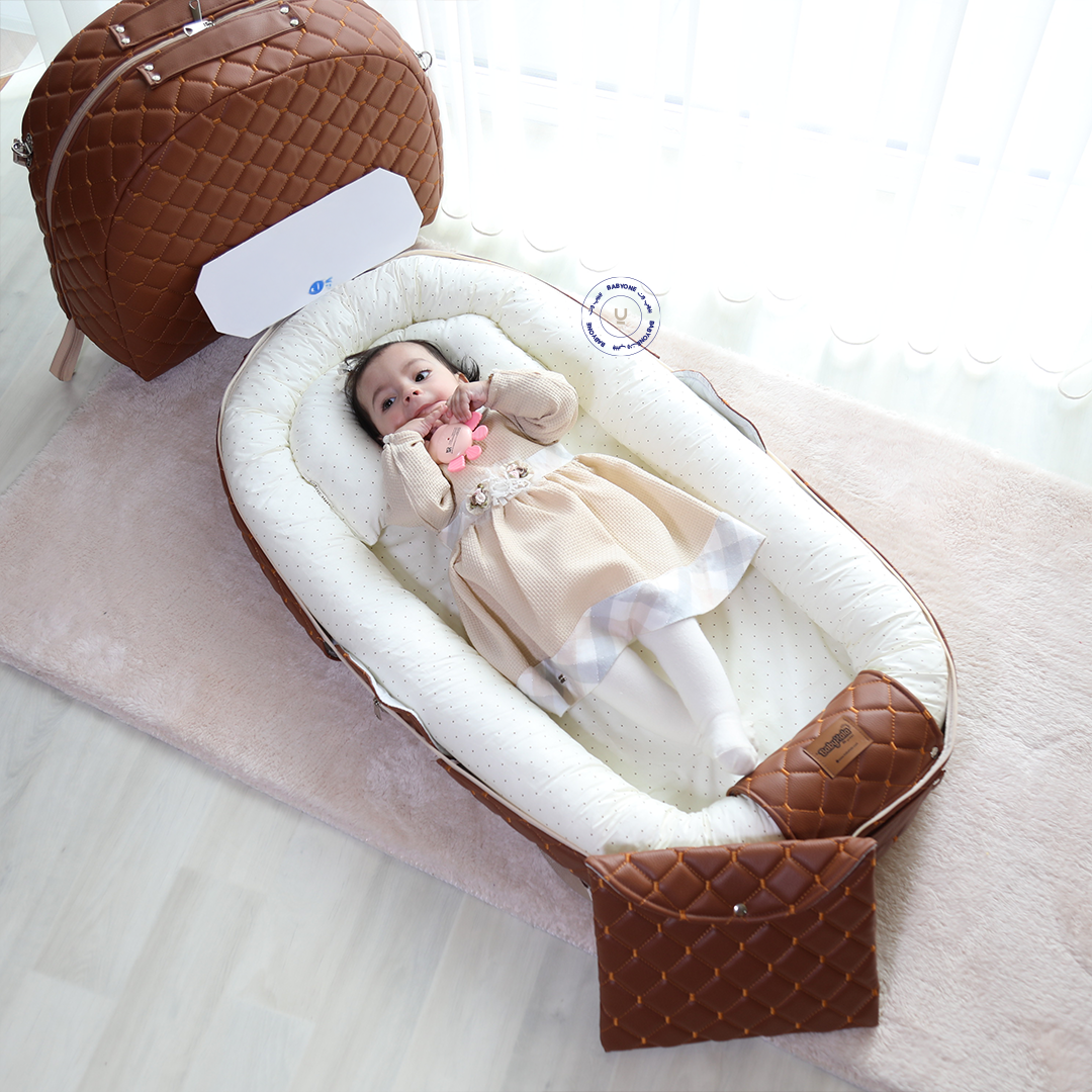 "الحضن المتنقل "المهد المحمول