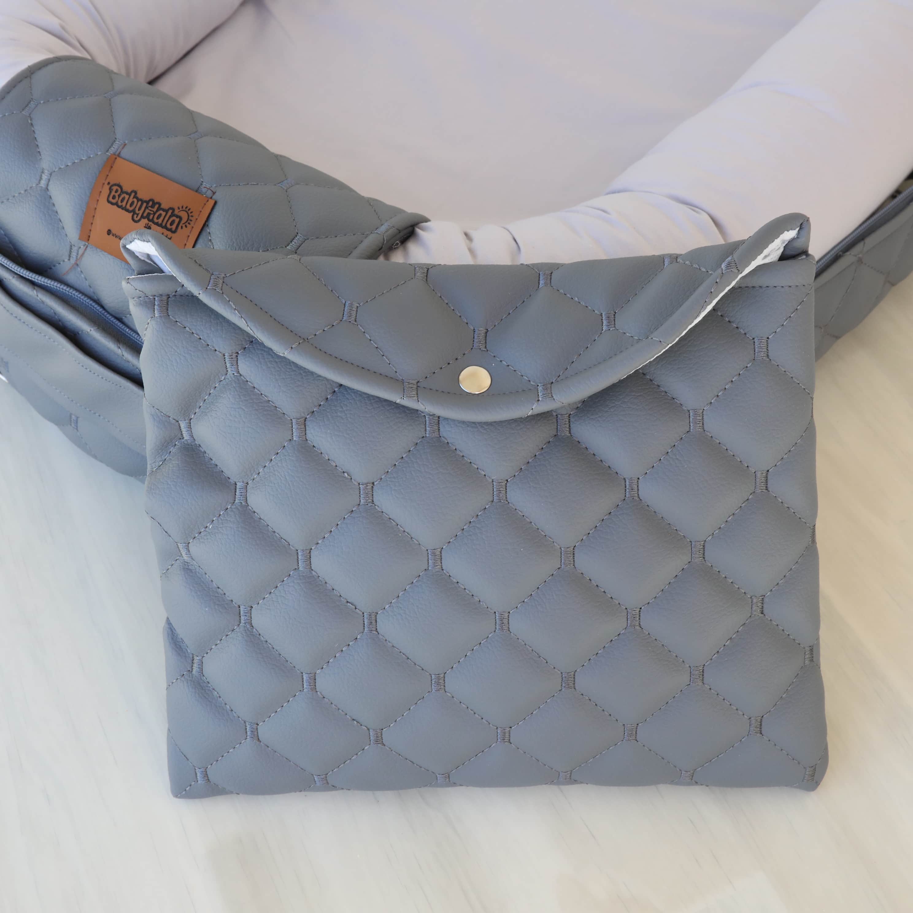 "الحضن المتنقل "المهد المحمول (الرمادي)