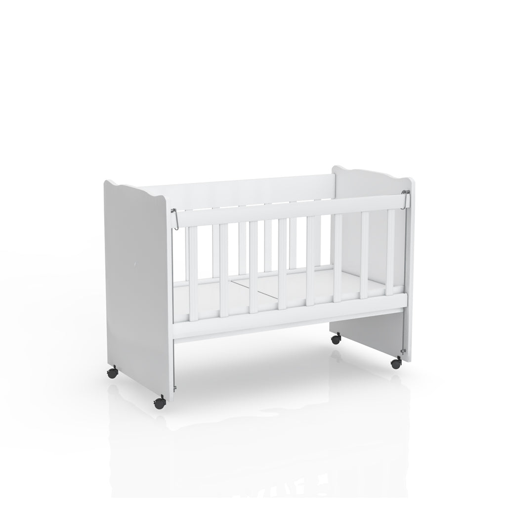 White Niro crib for children up to 3 years old, BabyOne brand, shown with safety rails and a cozy mattress inside.
