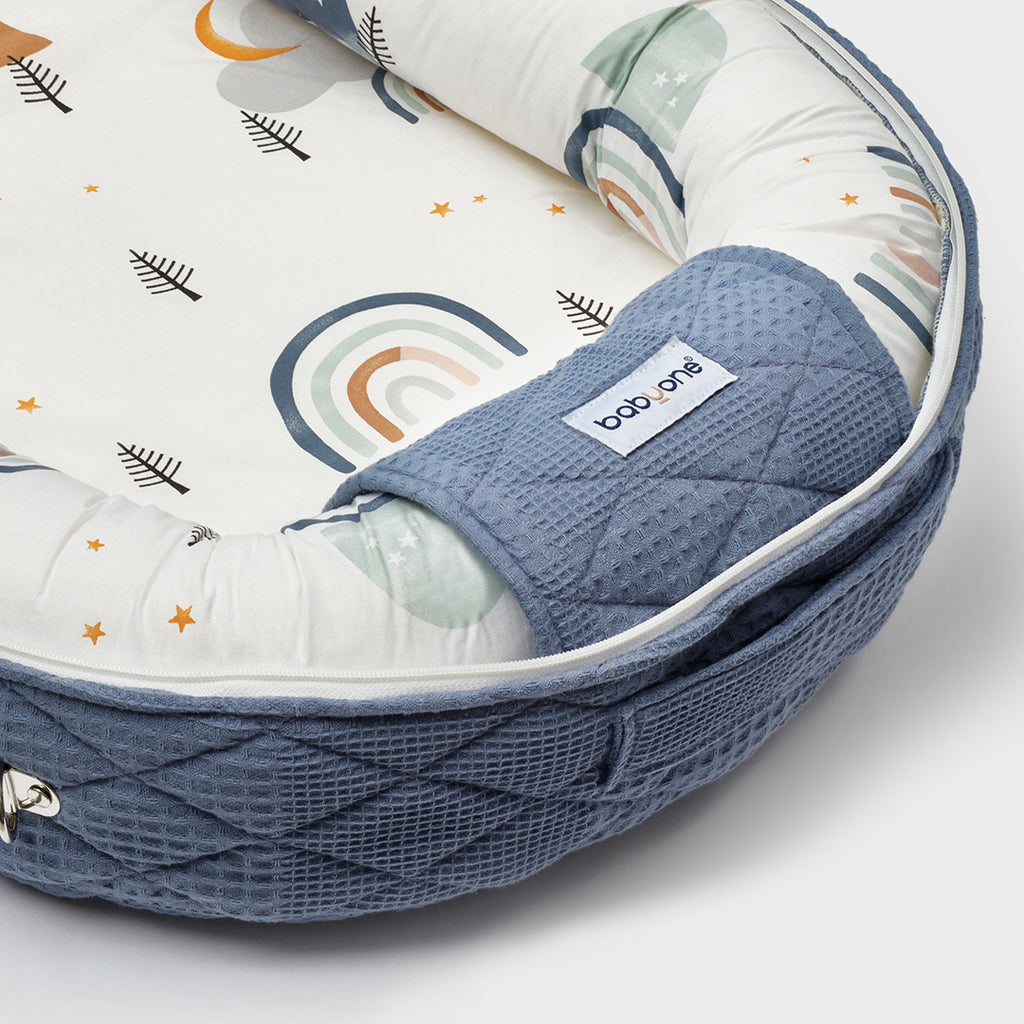 BabyOne Tom and Jerry portable cradle, a cozy mobile baby bed with cartoon character design for comfortable rest.
