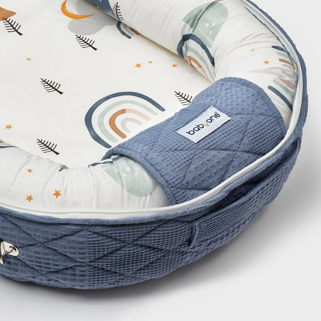 BabyOne Tom and Jerry portable cradle, a cozy mobile baby bed with cartoon character design for comfortable rest.
