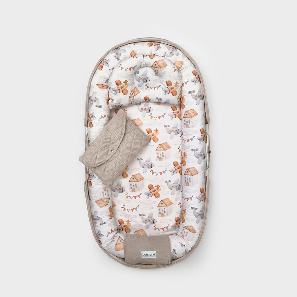 BabyOne portable crib with soft louver and sugar-themed bedding, designed for safe and comfortable infant sleep.